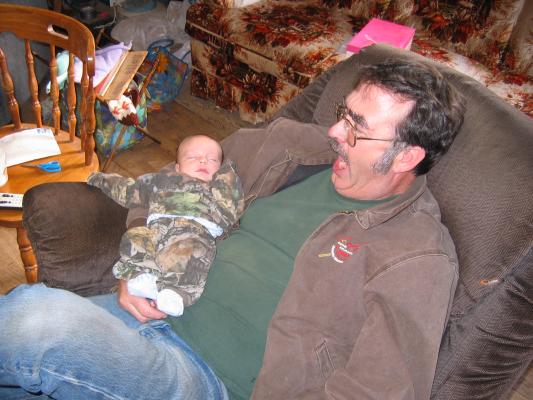 Carl Junior holds baby Jonathan.