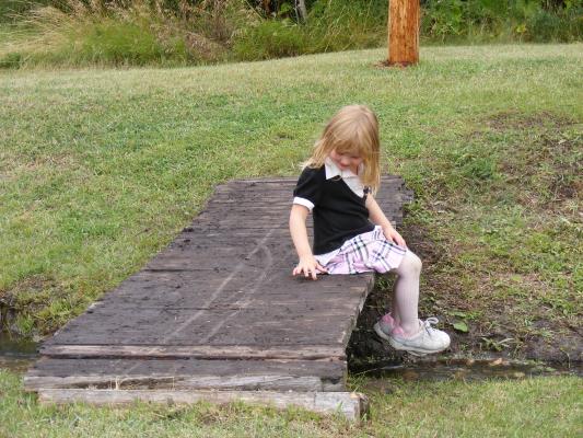 Sarah on a bridge at Little Rockies Christian Church