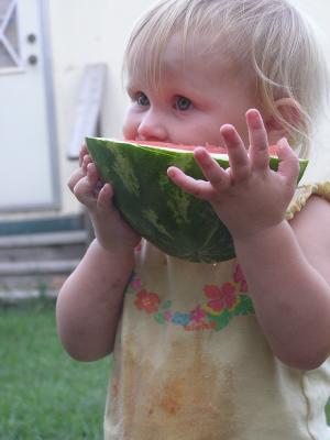 Sarah eats some watermelon.
