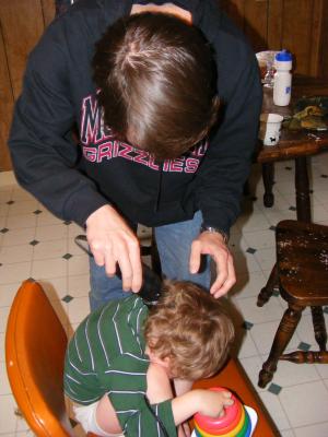 David cuts Noah's hair.