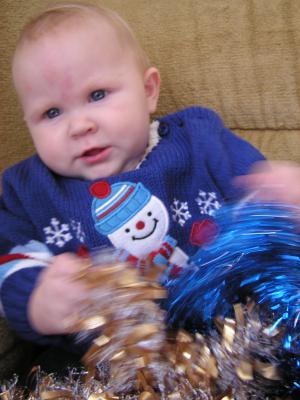Trying to get a good Christmas photo of Sarah.
She has a new blue sweater.