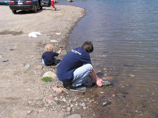 Noah and David throw some rocks.