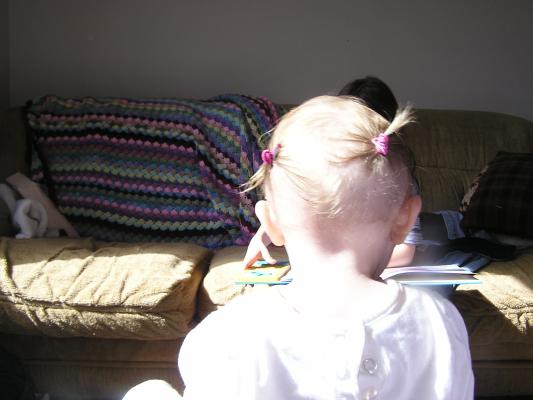 There is teh back of Sarah's head with ponytails