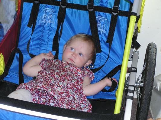 Sarah lounges in the bike trailer.