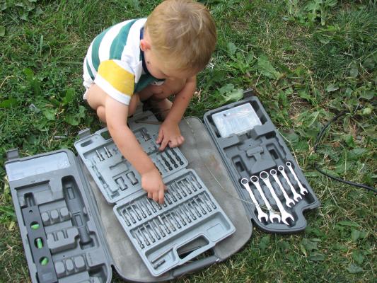 Noah plays with grandpa's tools