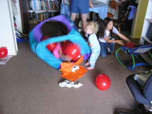 Noah and Andrea play with balloons.