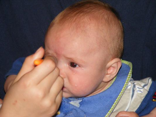 Joshua eats rice cereal
