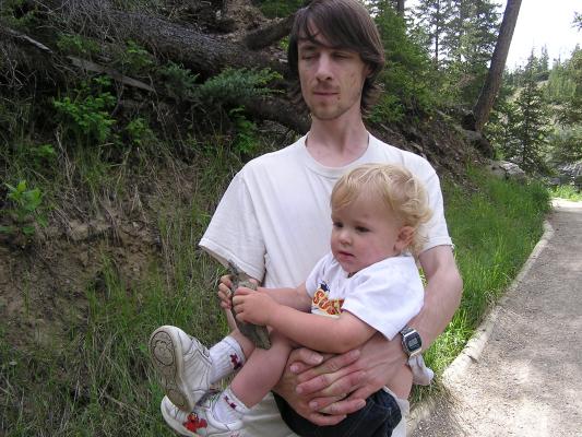 David carries Noah and a rock.