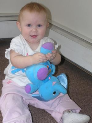 Sarah plays with her new elephant.