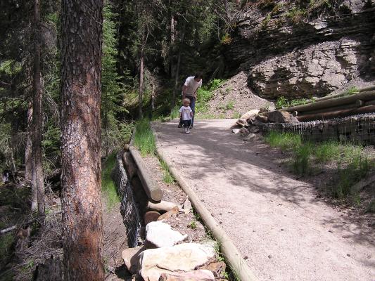 David and Noah walk down the trail.