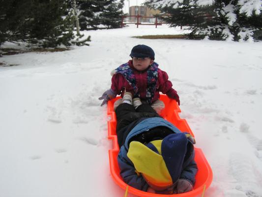 Noah's hat and Sarah in the sled.