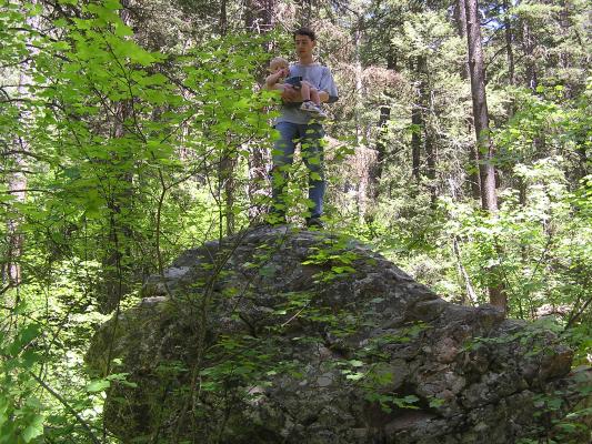 David and Noah on top of a big rock.