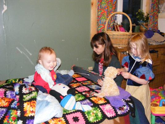 Joshua playing with Andrea and Sarah at his first birthday party. 