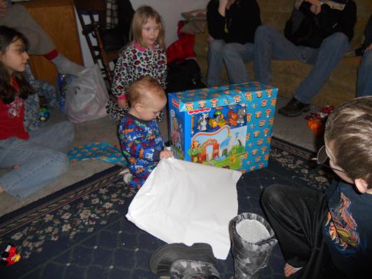 Mike and Cindy give Joshua a zoo. 