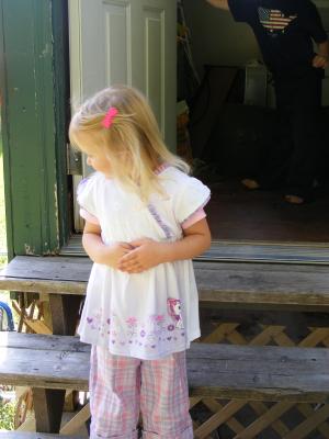 Sarah in pony shirt on the porch