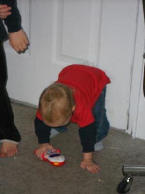 Joshua got a toy phone for his birthday. 