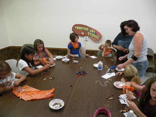 Orange Aspens at the craft table.