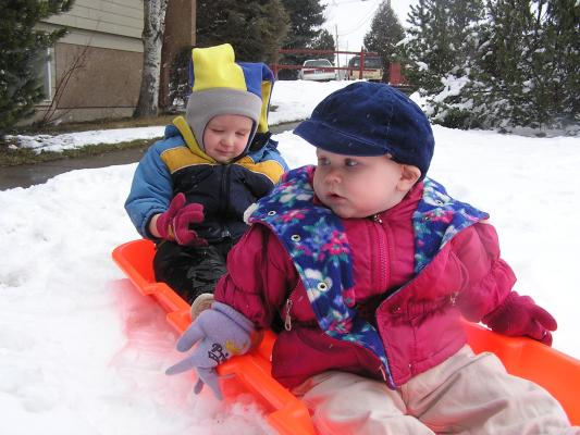 Noah and Sarah in a sled.