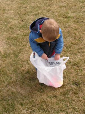 Noah gathers Easter eggs at the GVCC Easter egg hunt.