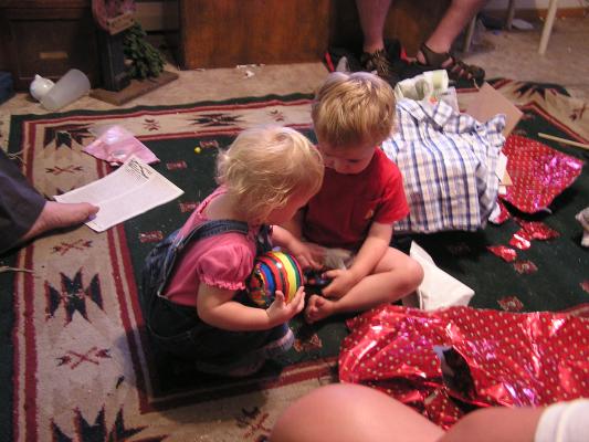 Sarah and Noah play with new toys