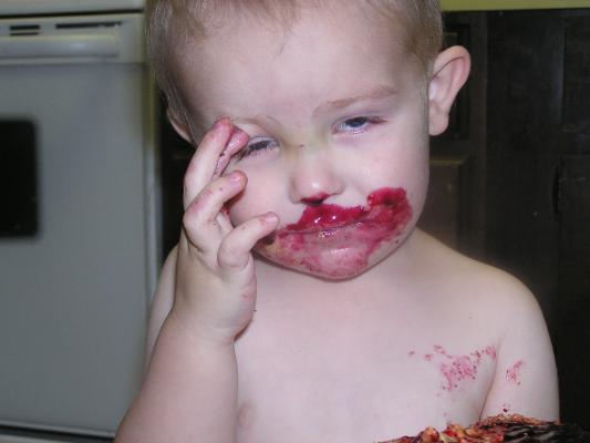 Noah had some jelly on a sandwhich.