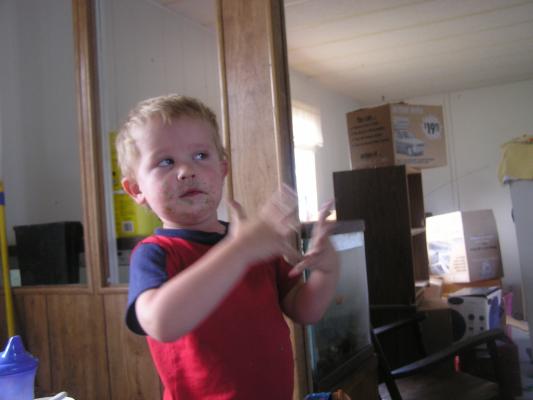 Noah is dirty faced from his birthday cake