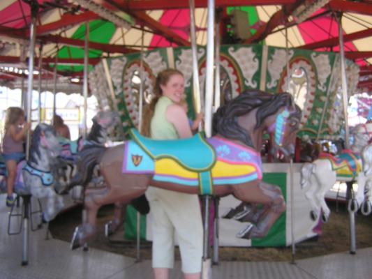 Katie hleps Sarah take a ride.