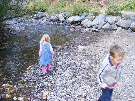 Sarah and Noah play in the creek.