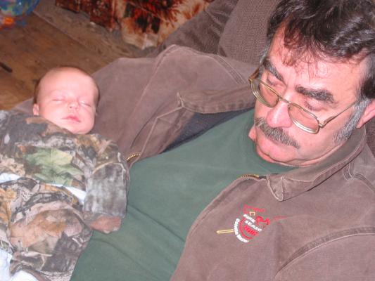 Carl Junior holds baby Jonathan.
