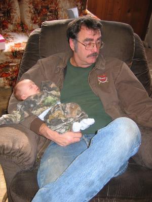Carl Junior holds baby Jonathan.
