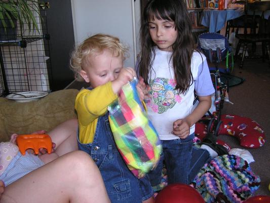 Noah opens another gift.