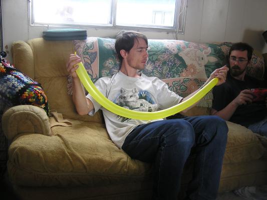 David plays with a baloon, while Jim watches