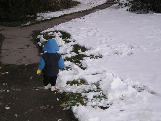 There's more snow on the other side of the sidewalk.