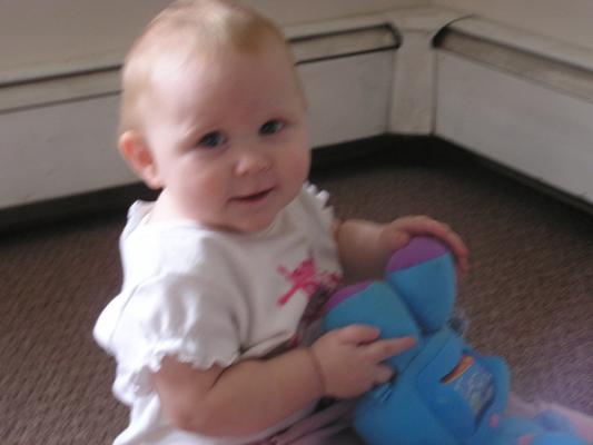 Sarah plays with her new elephant.