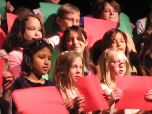 Malia singing with her class