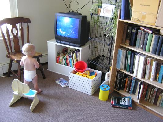 He was sitting in the chair watching TV and it was really cute.