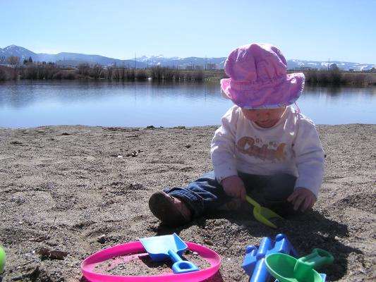 Sarah digs in the sand.