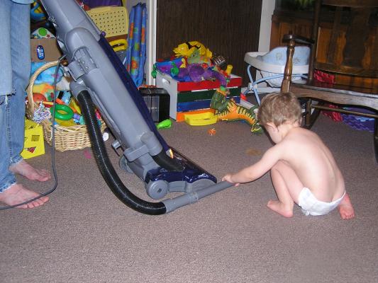Noah likes to help vacuum up stuff.