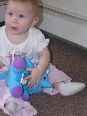 Sarah plays with her new elephant.