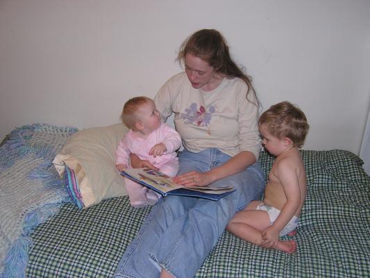Noah and Sarah listen to a bedtime story on Noah's new bed