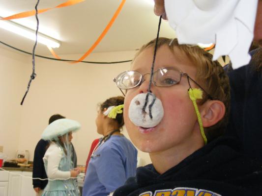 Noah with a donut on a string.