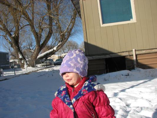 Sarah plays outside in the snow.