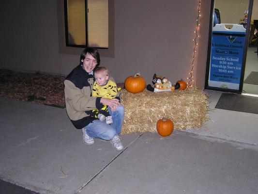 David and Noah by the hay bale and pumkings outside the church.