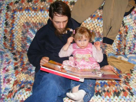 David reads to Sarah.