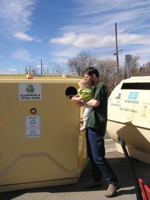 Now Sarah can put a can in the recycling container.