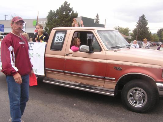 Tom handing out fliers. Breeanna at shotgun