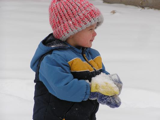 Noah plays in the snow.