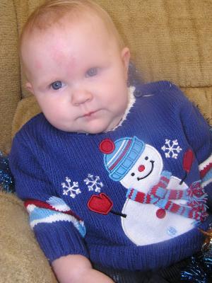Trying to get a good Christmas photo of Sarah.
She has a new blue sweater.