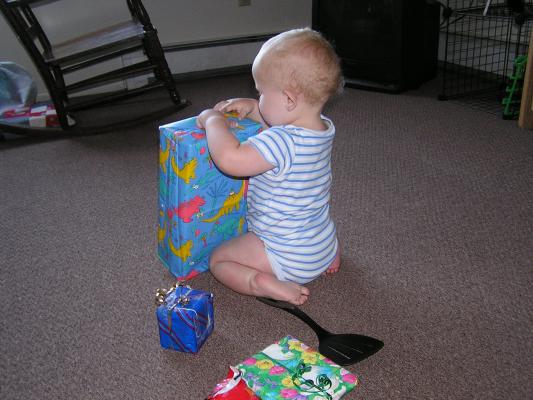 I think I'll open the one with dinosaurs on it.