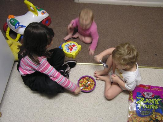 Andrea, Sarah and Noah are eating fruity balls.
